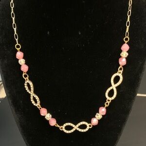 Gold tone and Pink crystal Infinity links Necklace
NWOT